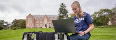 Emily Yale, one of the three inaugural students in our Master's of Engineering in Global Entrepreneurship program, with her autonomous robot at the Great Lawn on Oct. 7, 2019. (Sean Flynn/UConn Photo)