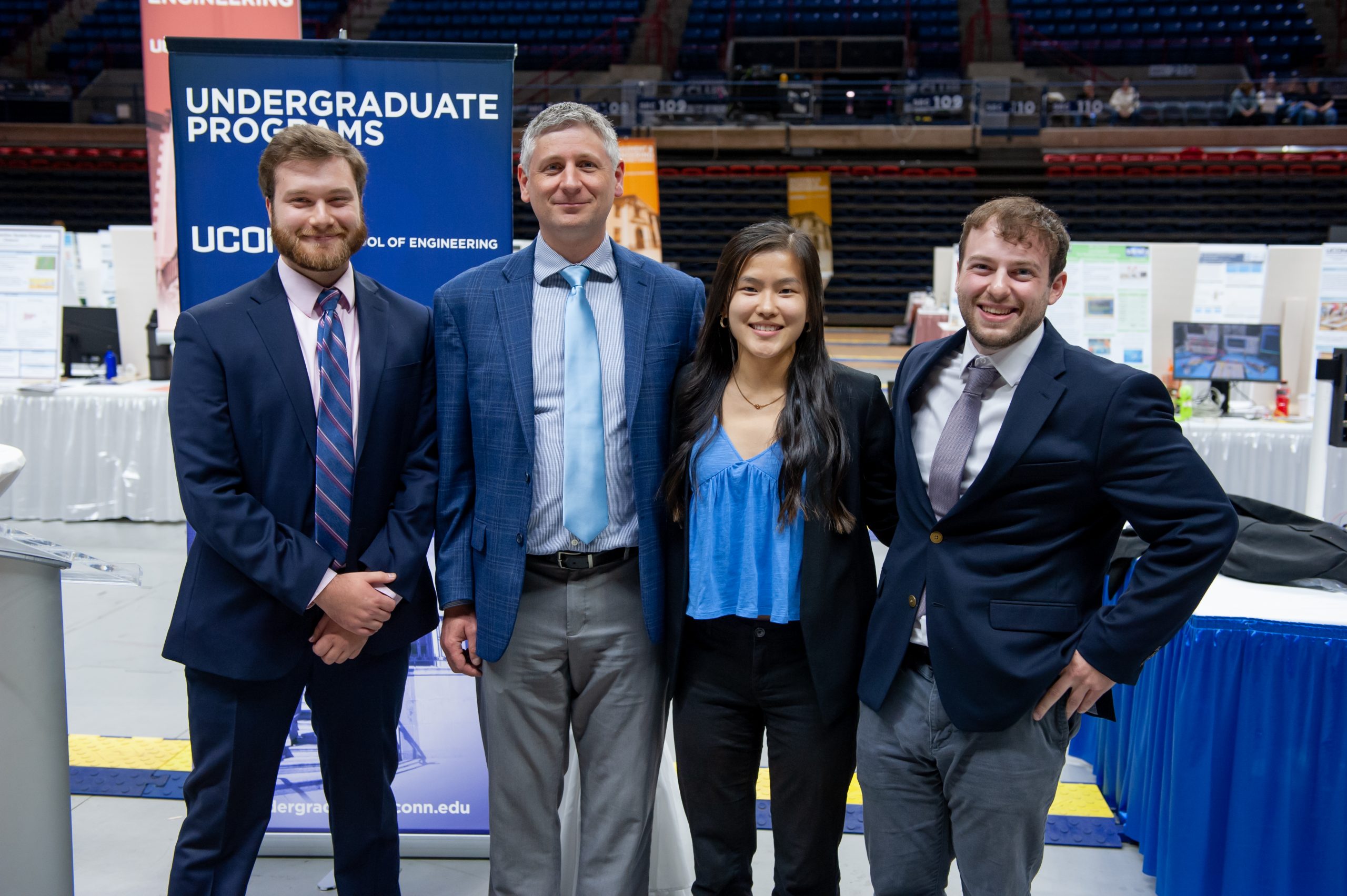 Professor Calvert with a team during Senior Design Demo Day.