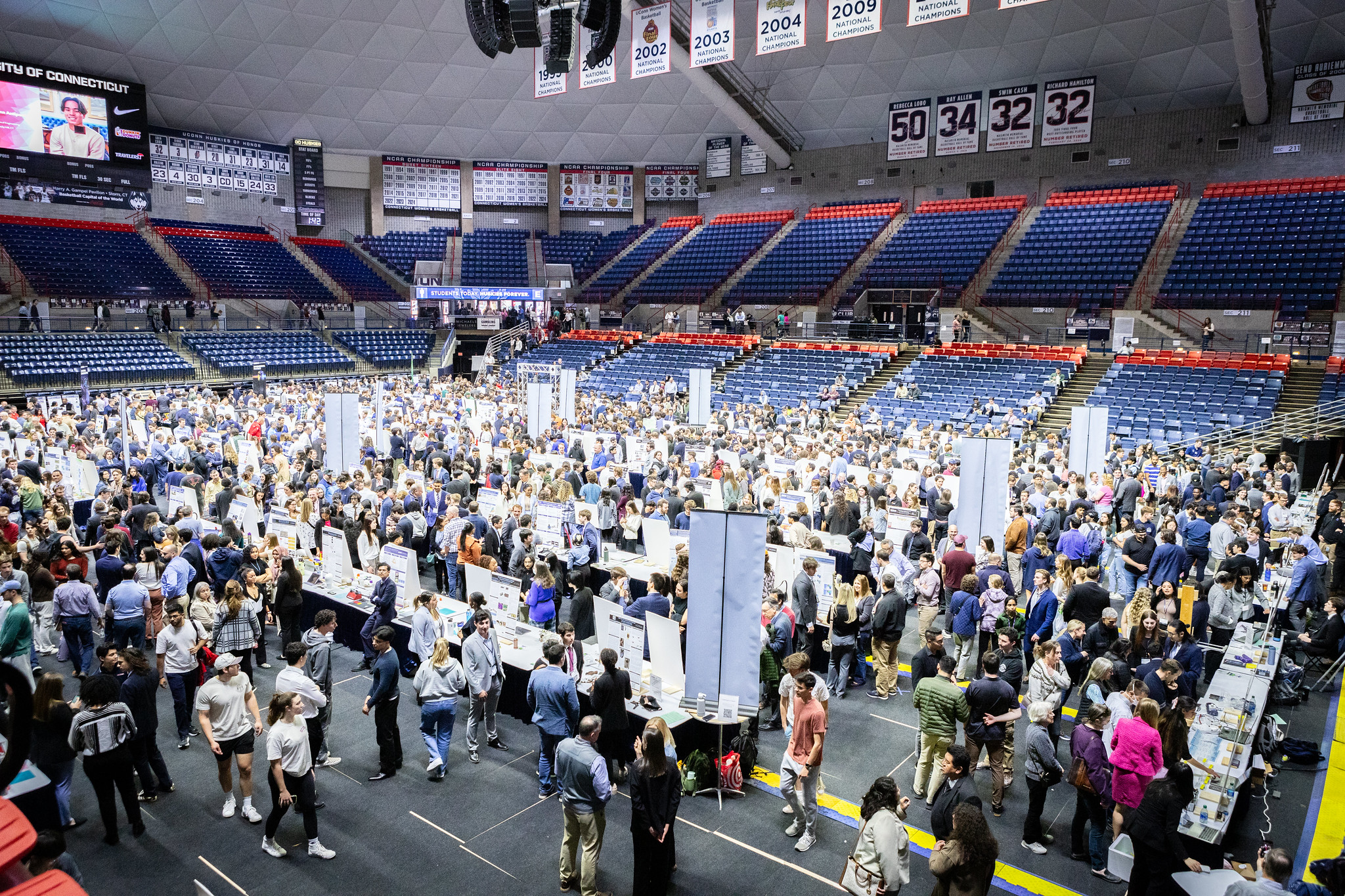 Inside view of Gampel Pavilion, where visitors walk around to students' projects during Demo Day.